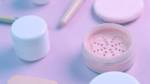 Rotate background with makeup brushes and eyeshadow palettes cream bottles on Stock Footage 247655110