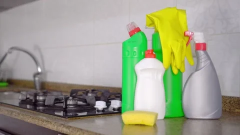 Rotate camera from kitchen focus to bottles of cleaning and detergent. Stock-Footage 170442170