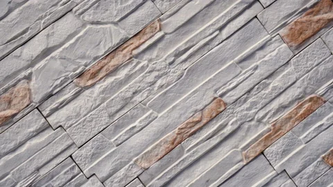 Rotate of decorative stone. Move up the granite to the house. Wall of stone. Stock Footage 99228129