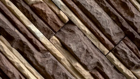 Rotate of decorative stone. Move up the granite to the house. Wall of stone. Stock Footage 99355706
