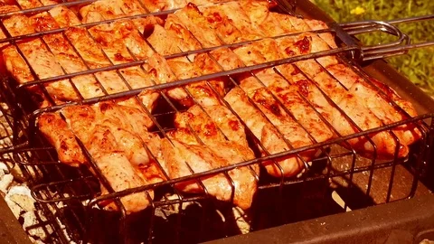 Rotate the grill with chicken Stock Footage 76407485
