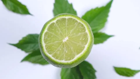 Rotate half lime isolated on white background Stock Footage 198569615