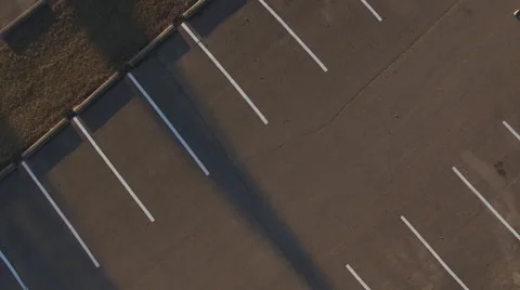 Rotating above empty parking spots in lot aerial view 4k 스톡 동영상 59810191