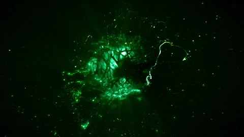 Rotating Abstract Energetic Green Glowing Particle Nucleus Loop Background Video stock 234472086