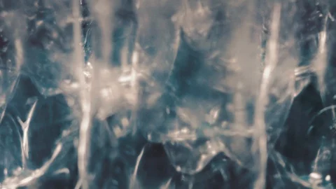 Rotating abstract plastic background in blue. Used plastic bottles. Close-up Video stock 122856097