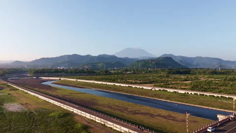 Rotating Aerial Drone Shot with Distant Mountain and River Below Stock Footage 344871948