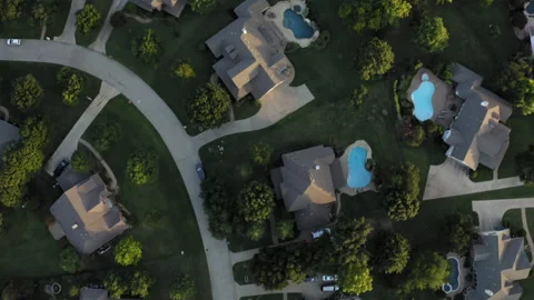 Rotating aerial looking down at Texas neighbordhood with unique street layout Stock-Footage 248079766