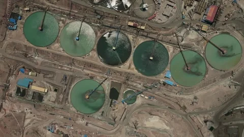 Rotating Aerial Perspective of Circular Water Recovery Systems in Copper Mine Stock Footage 337442245