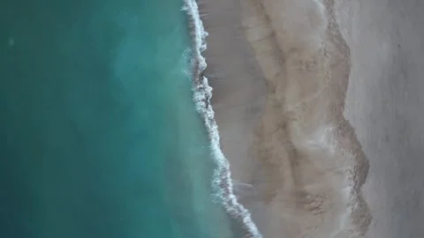 Rotating Aerial Shot of Beach Waves on Sand 動画素材 270646562