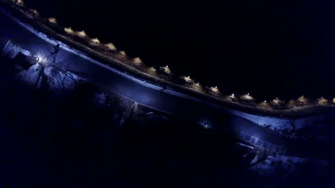 Rotating Aerial Shot of Dark Pathway on Namsan Mountain at Night Stock Footage 78497878