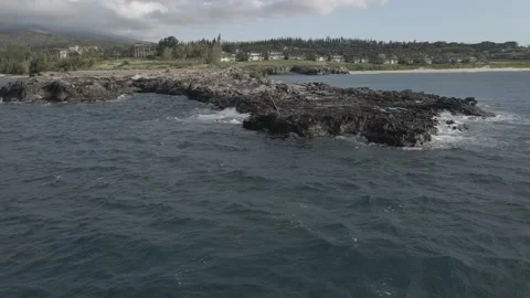 Rotating aerial shot of Dragon's Teeth point in Kapalua Maui Hawaii Stock Footage 133012957
