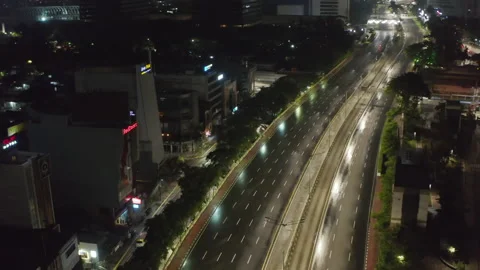 Rotating aerial shot flying parallel to an empty multi lane street during Stock-Footage 146877821