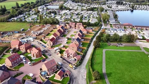 Rotating aerial view around a new housing estate being built Video stock 342949959