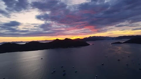 Rotating aerial view of dramatic sunset over Coron Bay, Palawan, Philippines Stock Footage 325794473