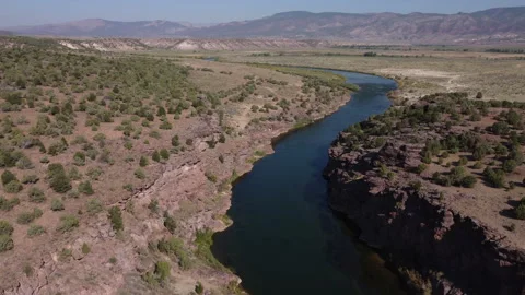 Rotating aerial view of Green River in Utah in the fall with cliffs Stock Footage 276415172