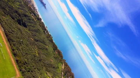 Rotating aerial view of La Jolla coastline with blue Pacific Ocean cliffs Stock Footage 330516761