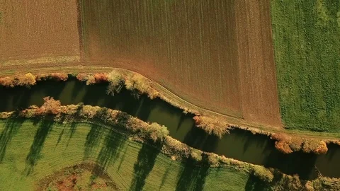 Rotating aerial view of river in fall countryside Stock Footage 98545065
