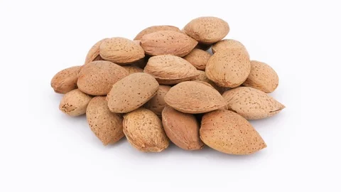 Rotating almonds isolated on white background Vídeo Stock 87681288