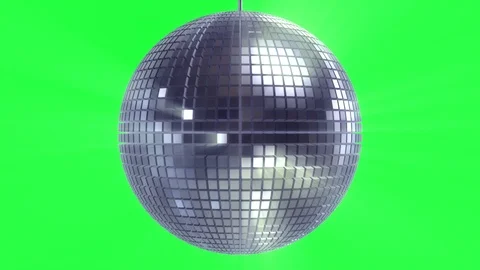 Rotating and glowing disco ball on green Stock Footage