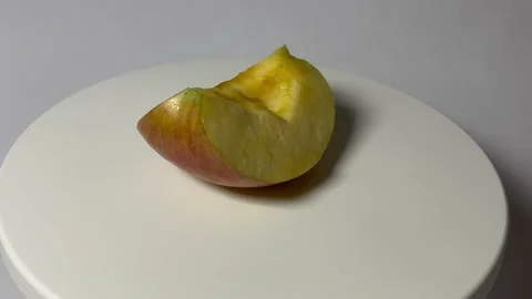 Rotating an apple 360 degrees: an experiment on a turntable Stock Footage 239182280