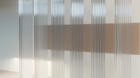 Rotating architectural fluted glass louvers casting caustic shadows on ston.. Stock Footage 346647264