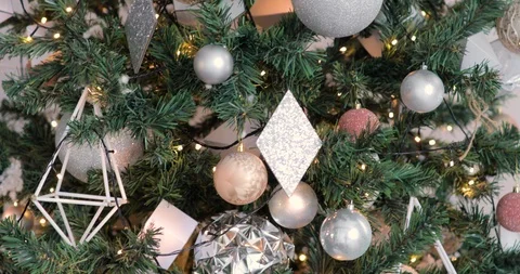 Rotating around Christmas tree decorated with silver balls and garlands. Video stock 120133720