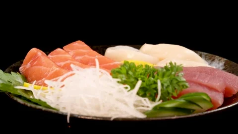 Rotating Assorted Sashimi Platter on Black Background Vídeos de archivo 313573590