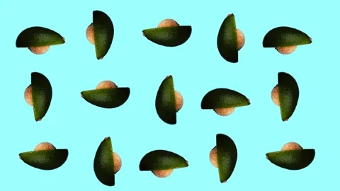 Rotating avocado pattern on cyan background Stock Footage 156813306
