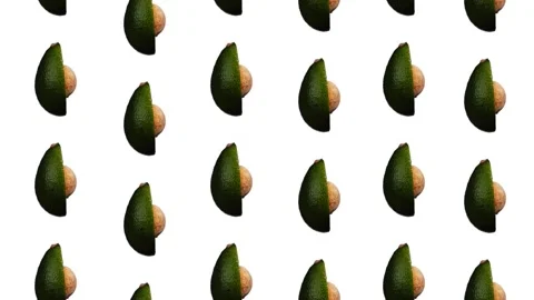 Rotating avocado pattern on white background Stock Footage 156813361