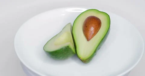 Rotating Avocado on a Plate Stock Footage 124659339