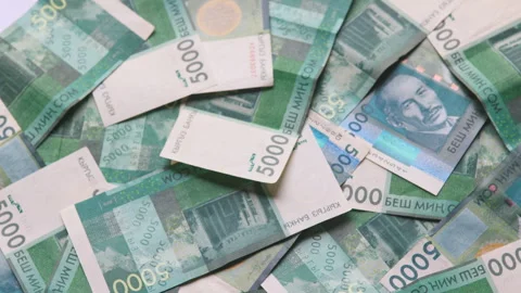 Rotating background of 5000 Kyrgyzstani Som banknotes Stock Footage 304723971