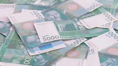 Rotating background of 5000 Kyrgyzstani Som banknotes Stock Footage 314132789