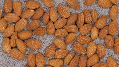 Rotating background of almonds Stock Footage 105145620