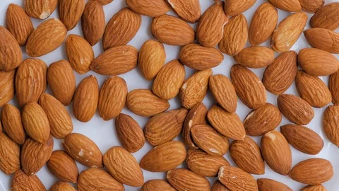 Rotating background of almonds Stock Footage 105283445