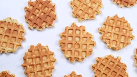 Rotating background of appetizing sweet waffles on a white background. Summer Stock Footage 195188232