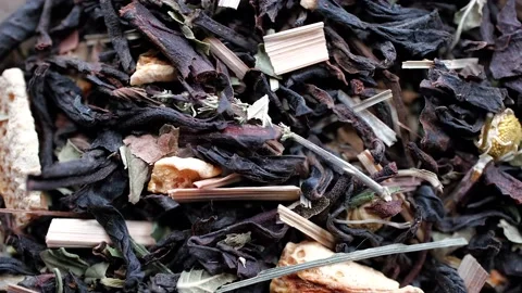 Rotating background from black tea blend with natural additives Stock Footage 232728238