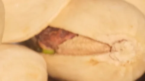 Rotating background bunch of pistachio nuts, ready to eat as food, close-up Vídeos de archivo 250111525
