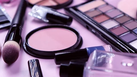 Rotating background with decorative cosmetics, blush, concealer, powder, shadows Stock Footage 220363800