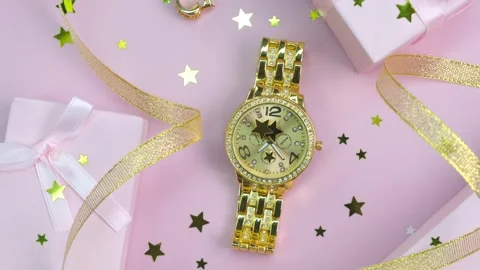 Rotating background of different fashionable women's accessories, watches, and Stock Footage 245894413