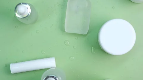 Rotating background of different lotion bottles and jars for creams and skin Stock Footage 245797749