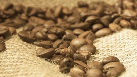 Rotating background of falling coffee grains with original audio Stock Footage 103108588