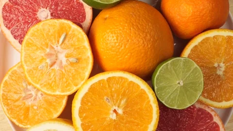 Rotating background of fresh assorted citrus fruits Stock Footage 342437428