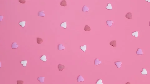 Rotating background of hearts on a pink background. The concept of love or Stock Footage 199997994