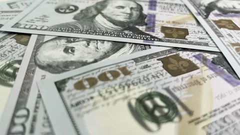 Rotating background of hundred dollar bills in close-up. Video stock 219868269