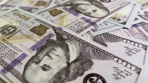 Rotating background of hundred dollar bills in close-up. High quality 4k footage Vídeos de archivo 220622521