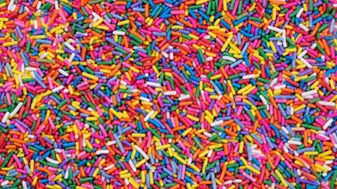 Rotating background of multi-colored sprinkles for sweets . Stock Footage 202199899