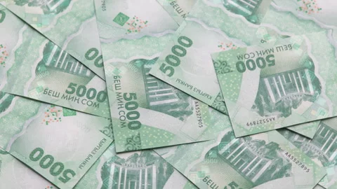 Rotating background of new 5000 Kyrgyzstani Som banknotes Stock Footage 312545853