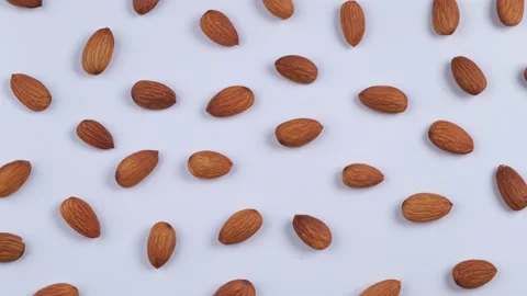 Rotating background nuts almonds on white background, the concept of healthy Stock Footage 194764630