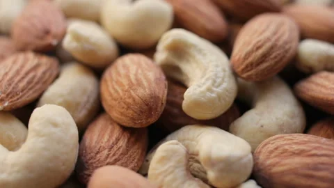 Rotating background of nuts mix. Assorted nuts. Stock Footage 106382988