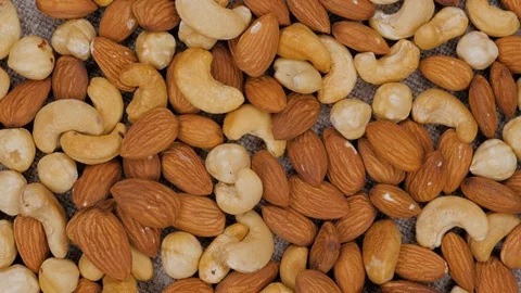 Rotating background of nuts mix. Cashew. Hazelnut. Almond. Assorted nuts. Stock Footage 105282954